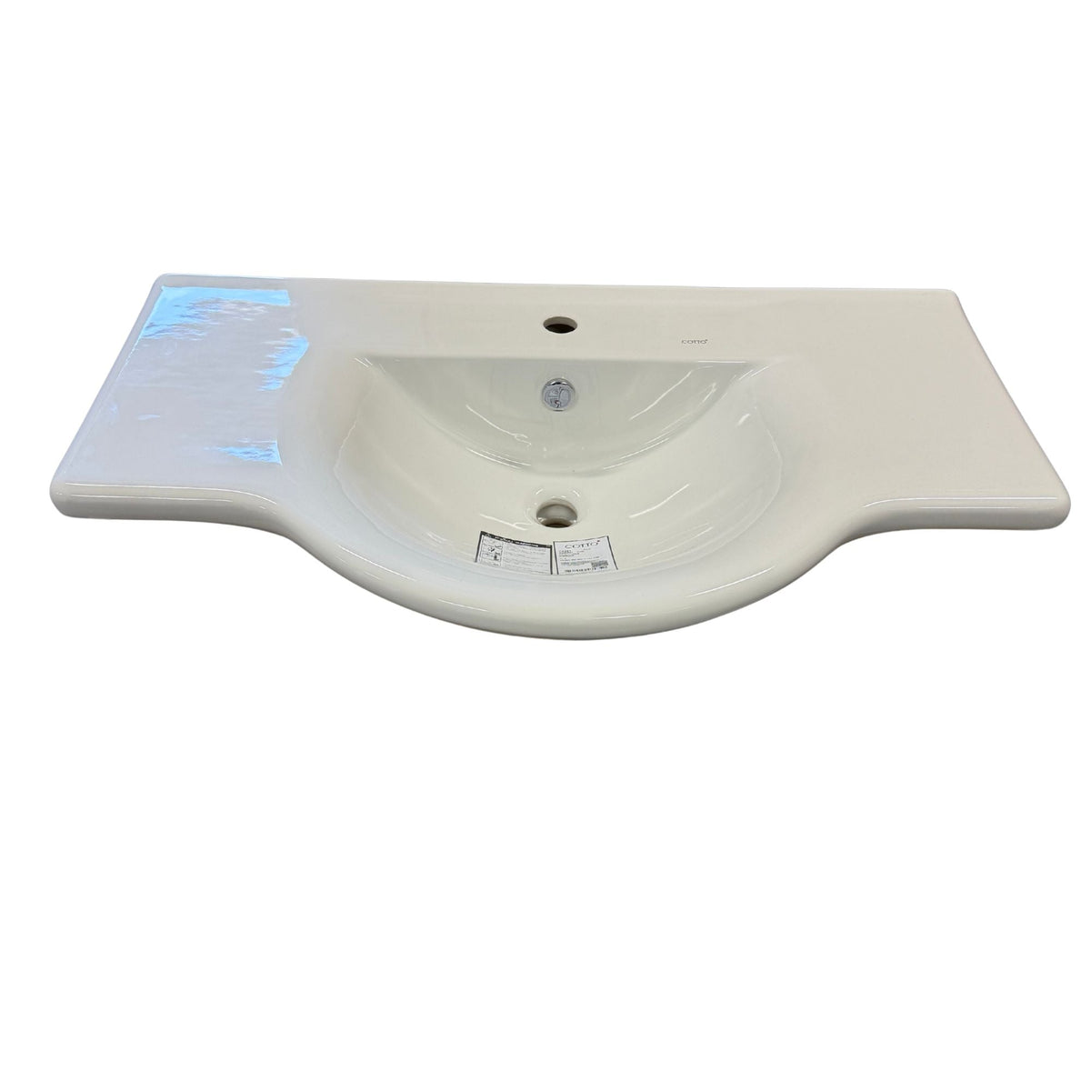 Tvättställ i vitt porslin 90 cm med kranhål och bräddavlopp, snett framifrån – COTTO Nine-O C0281