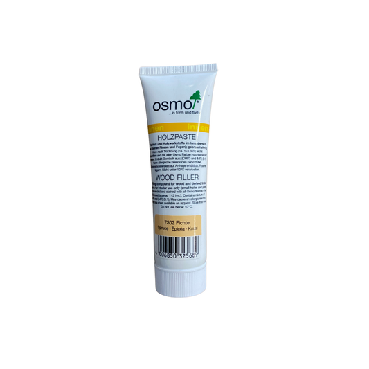 Tub Osmo Träspackel 7302 Furu 100 g, framsida med produktetikett på flera språk