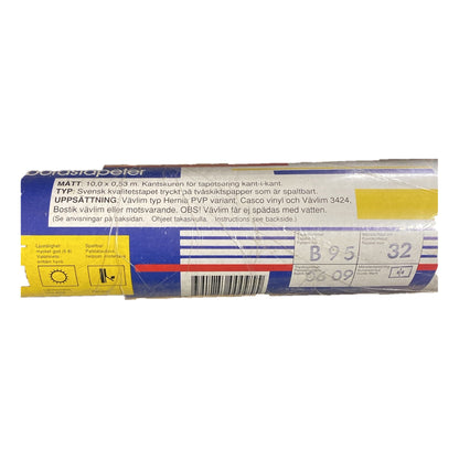 Tapetrulle B95 med etikett, trycknummer 0609 och mönsterhöjd 32 cm