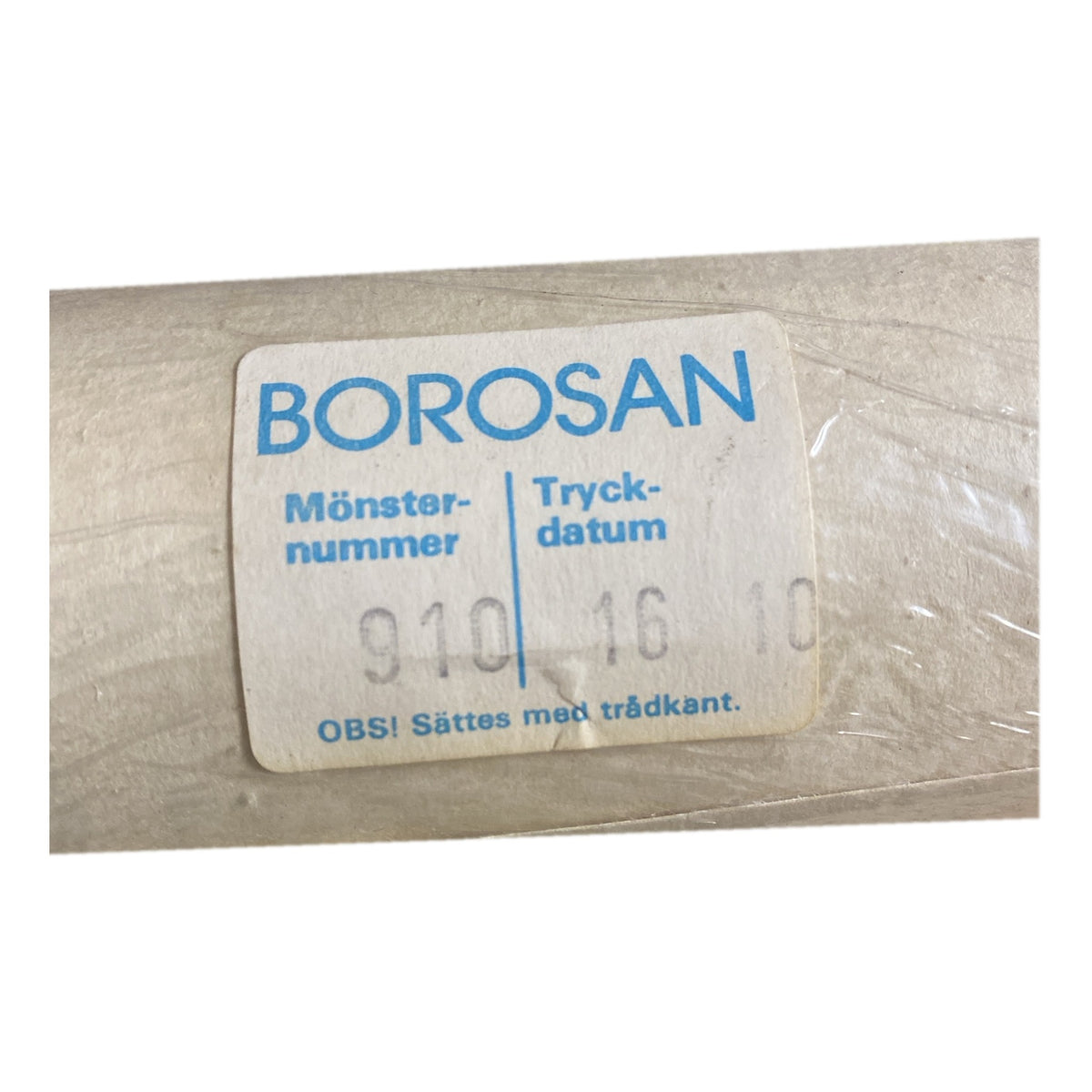 Tapetrulle Borosan 910 etikett med tryckdatum 16/10