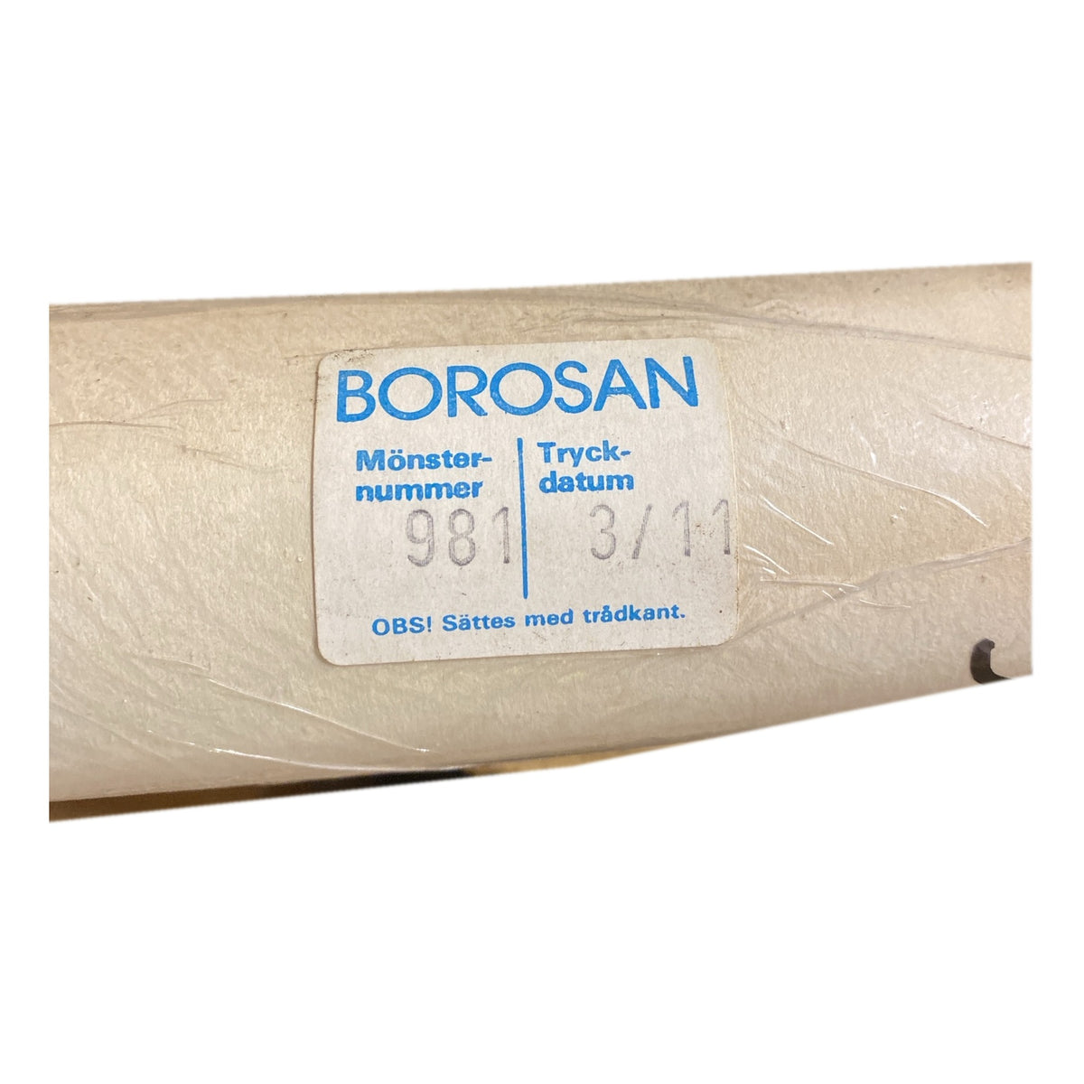 Tapetrulle Borosan 981 med etikett
