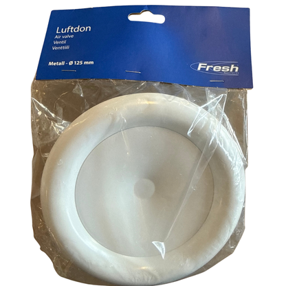 Rund vit tallriksformad luftventil i metall, synlig genom förpackningens plast
